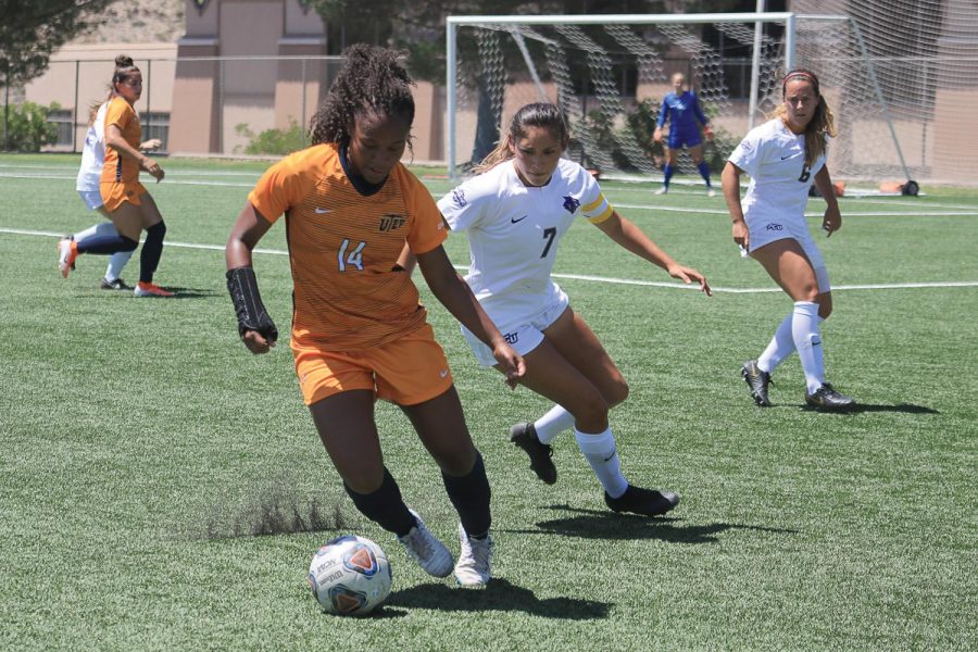 Defender Kori Lewis fights the ball against Abilene Christian University Sunday Aug. 24. 