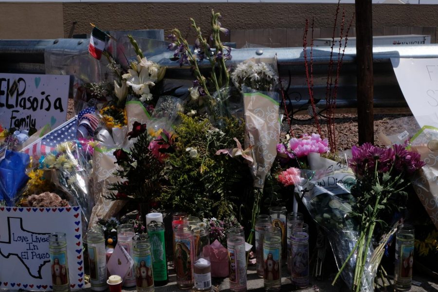 Candles and flowers are added to the makeshift memorials created for the victims of Saturdays shooting at Cielo Vista Wal-Mart.