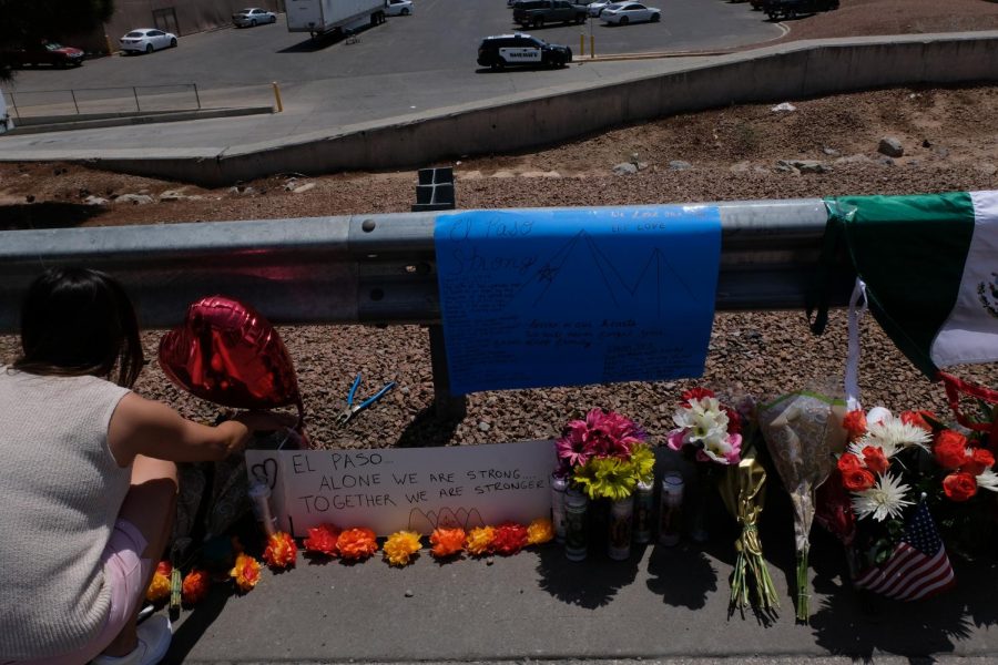 A woman pays her respects to the victims of Aug. 3, 2019 mass shooting at Cielo Vista Wal-Mart. 