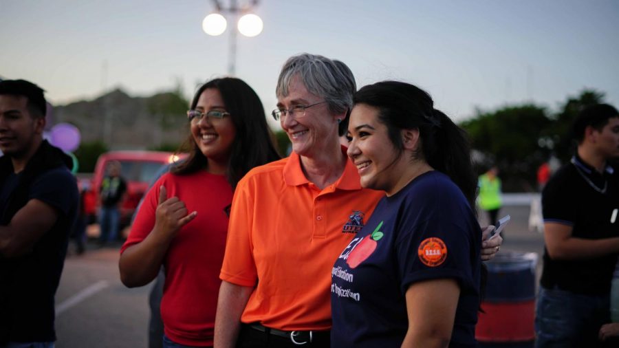 UTEP President Heather Wilson poses for a photo with students in 29th annual Minerpalooza at the Sunbowl parking lot, Aug. 30, 2019.