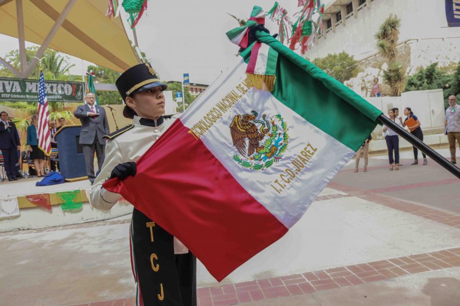 Escolta leader folds Mexican flag at “El Grito” at the Union Plaza on Sept 13, 2019.