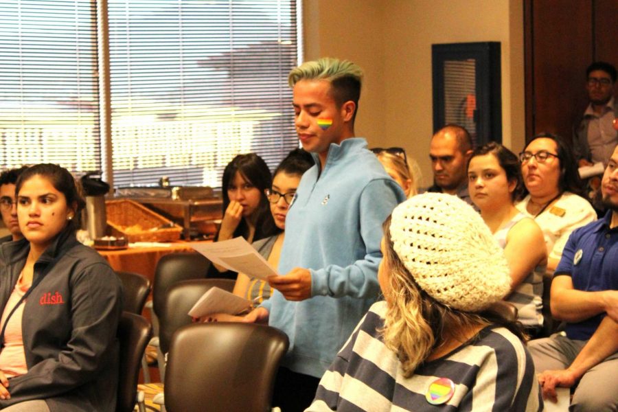 A student reads one of the audience lines during the play Queer as a Second Language from the Queer(in)g Our Classrooms event held Monday, Oct. 14, 2019.