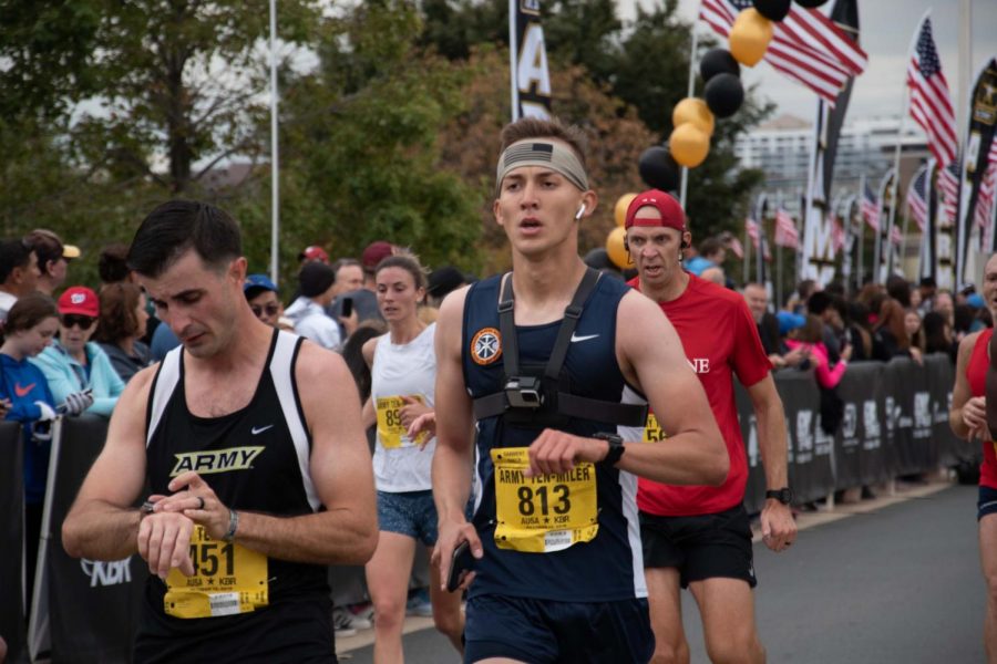 Team Capitan Cadet Alexander Greenman, Junior, runs through the finish line the fastest on the UTEP team at the end of the Army Ten-Miler race.