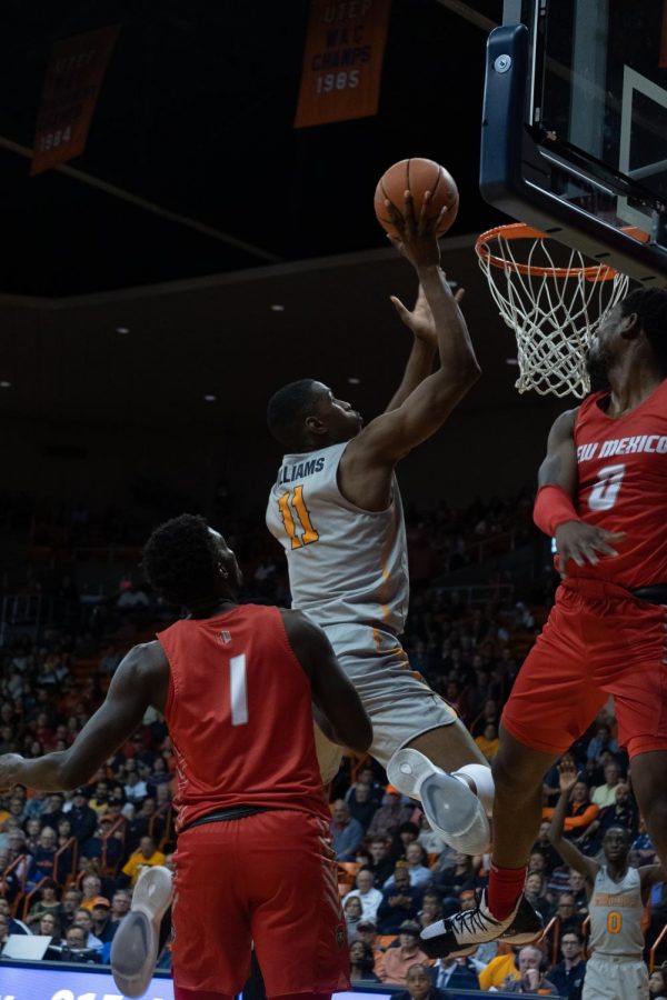 UTEP junior forward Bryson Williams drives to the basketball against UNM at the Don Haskins Center Nov. 20, 2019.