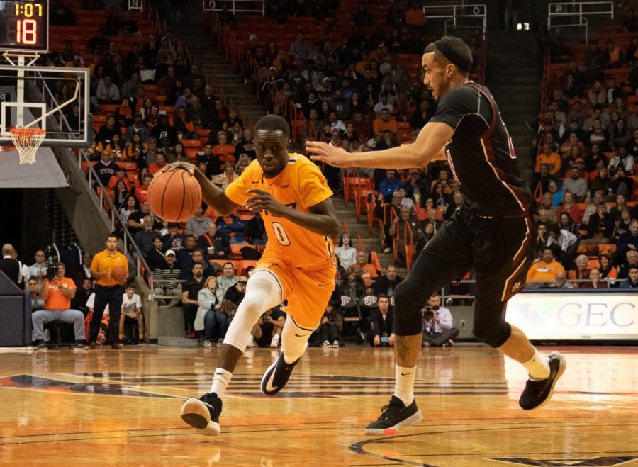 Sophomore guard  Souley Boum dribbles the ball past the NMSU defender at the Don Haskins Center.