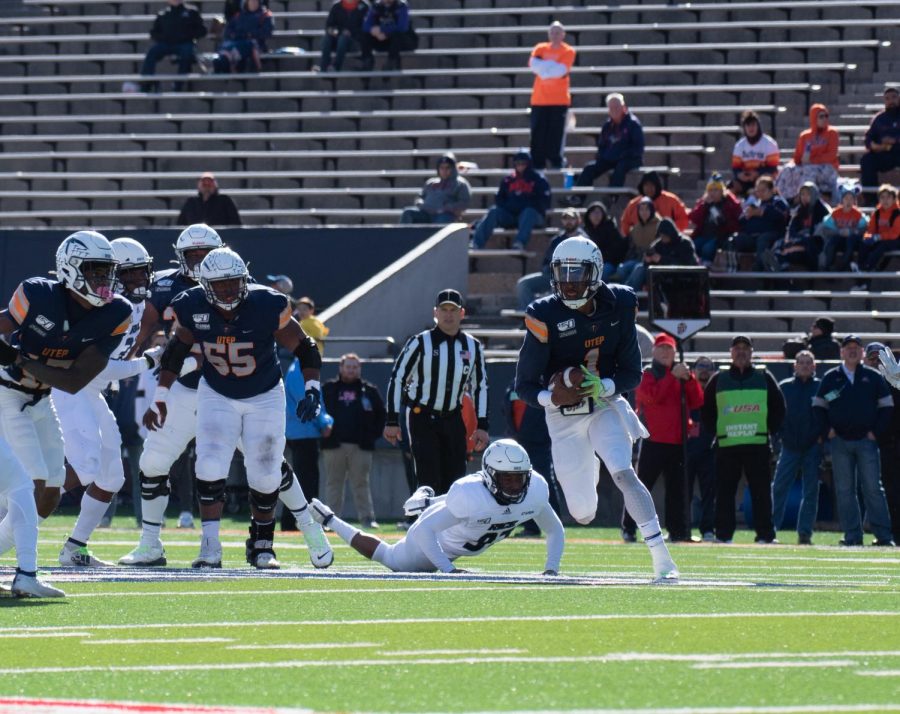 UTEP senior quarterback Kai Locksley rushes against the Rice defense Nov. 30 at the Sun Bowl.