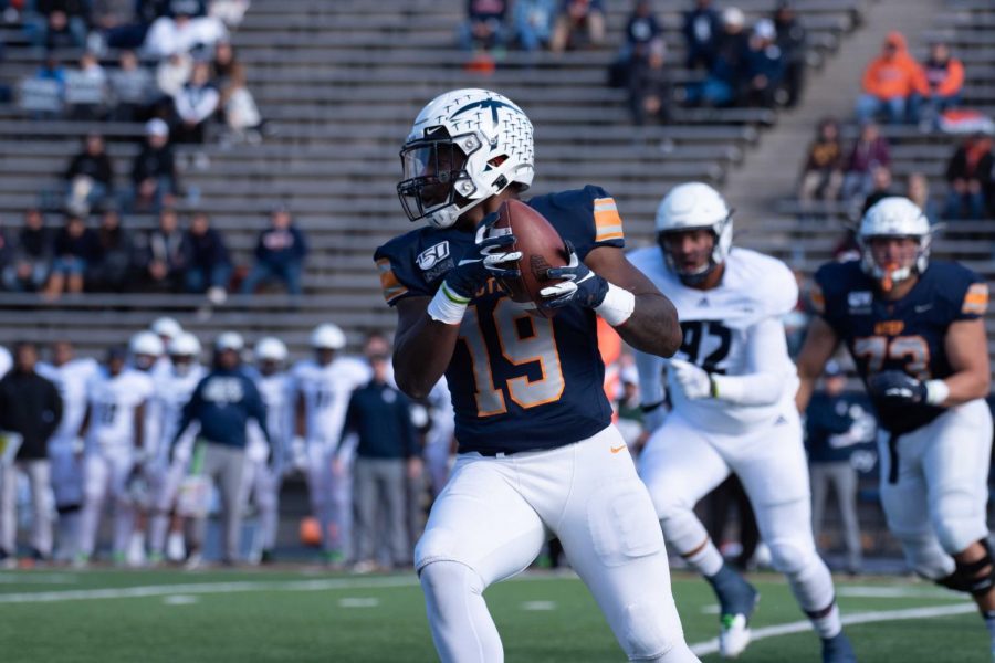 Senior Runningback Treyvon Hughes catches a screen pass and turns up field against the Rice Owls at the Sunbowl stadium.
