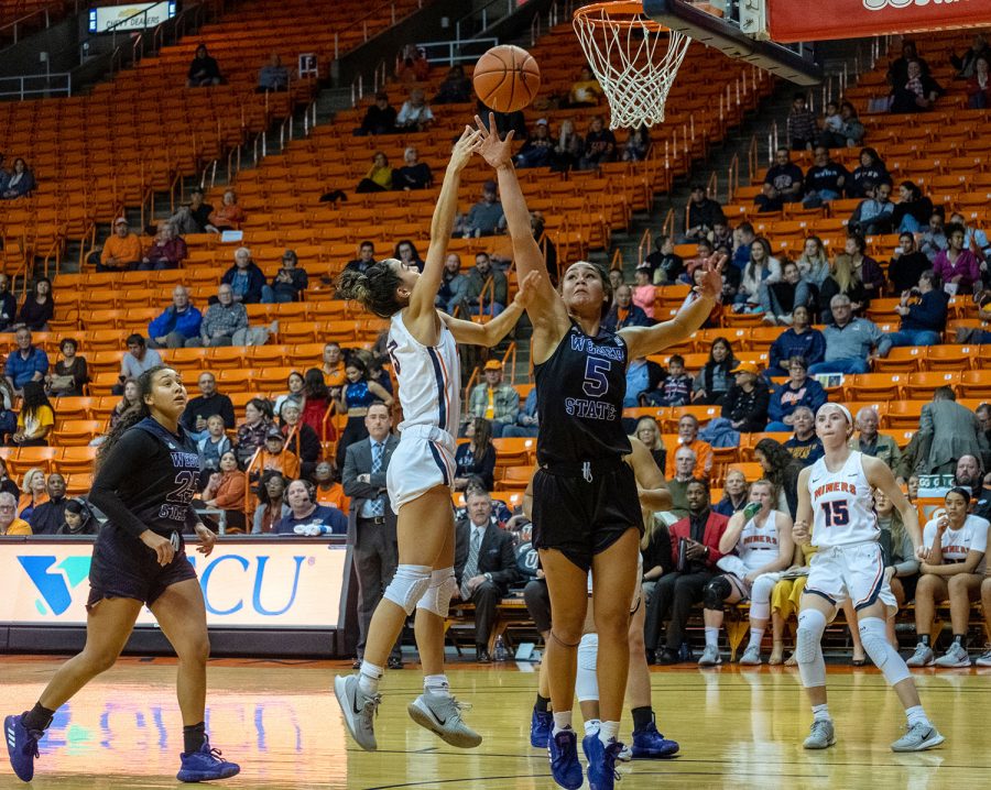 
UTEP  all confernce guard Katia Gallegos shoots over Weber State defender Dec. 5 2019.