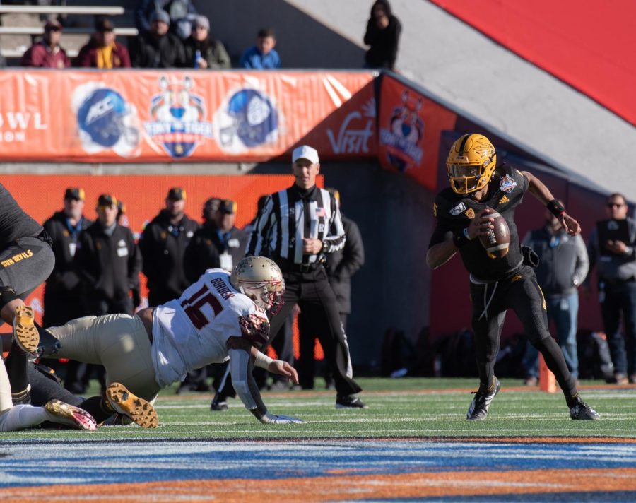 Arizona State freshman quarterback Jayden Daniels runs for positive yards at the 86th annual Tony The Tiger Sun Bowl.