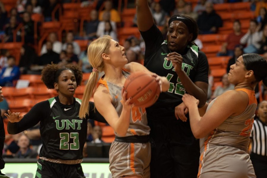 UTEP senior guard Katarina Zec puts up a shot against North Texas senior forward Anisha George at the Don Haskins Center.