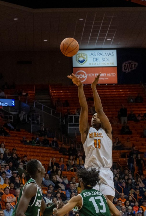 Junior forward Bryson Williams shoots over UAB defenders in loss Feb. 1.