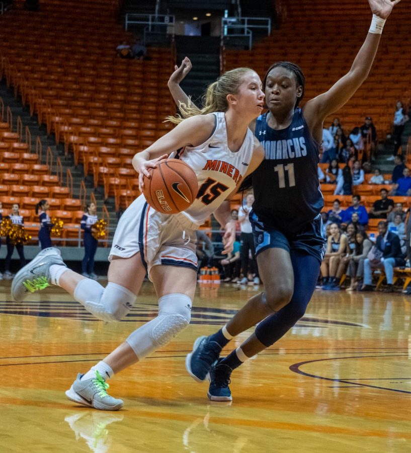 UTEP freshman guard  drives with heavy pressure from Old Dominion guard Taylor Edwards Saturday, Feb. 8.
