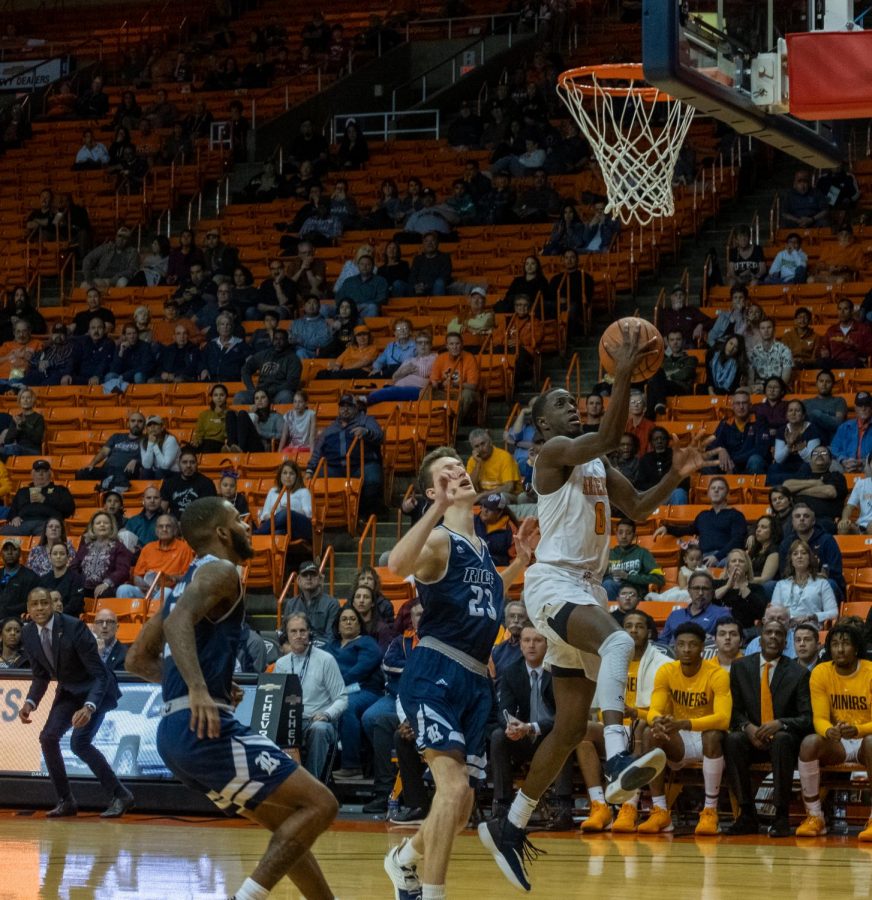 Miner sophomore Souley Boum drives to basket on fast break versus Rice Saturday, Feb. 22.