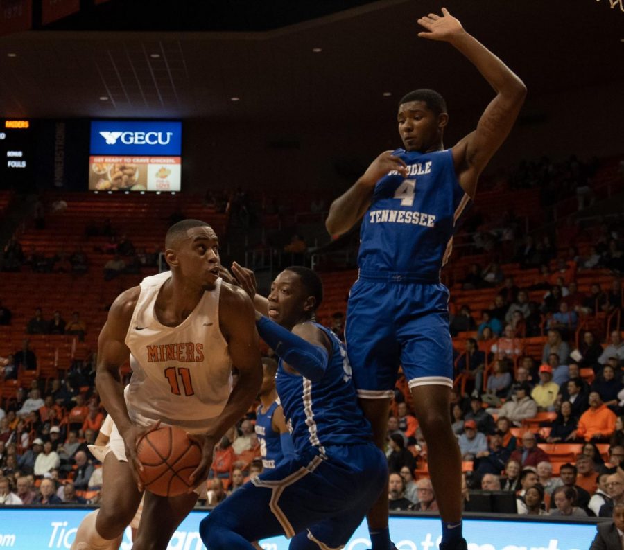 Junior forward Bryson Williams drives to basket against two Middle Tennessee State defenders Jan. 30.