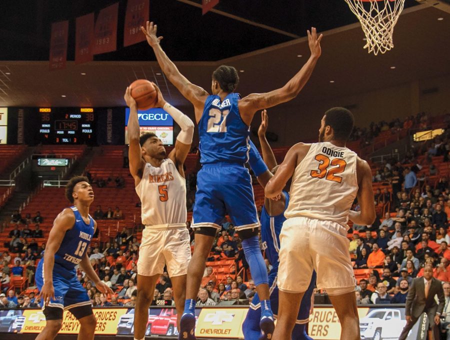 Freshman guard Deon Stroud pulls up for a jumper over Blue Raider defender versus Middle Tennessee State Jan. 30.