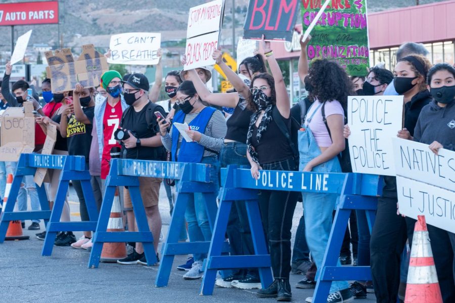 Protesters stand at the edge of police barriers outside police station in El Paso Sunday, May 31.