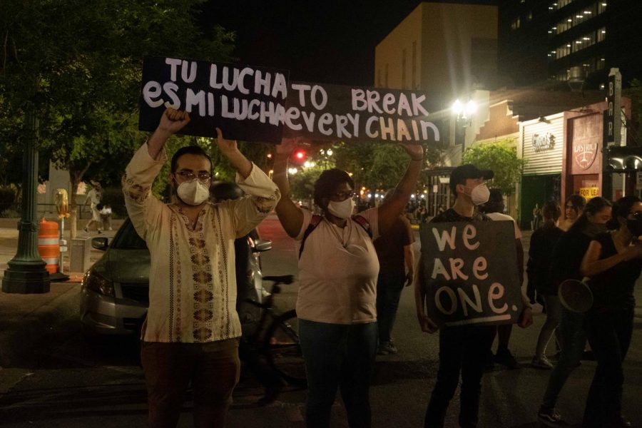 Protesters hold sign in support of black lives matter movement in downtown El Paso June 2.