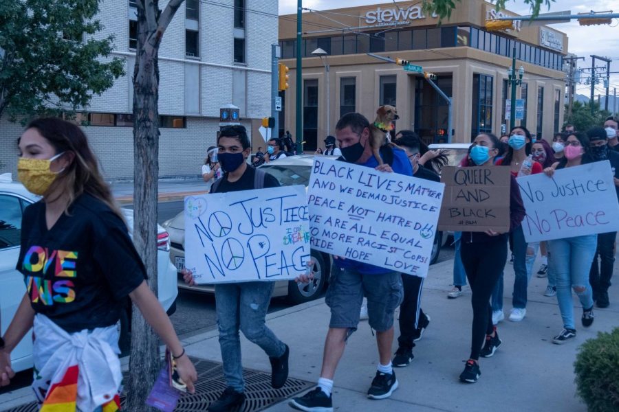 Protesters walk through Downtown El Paso during  Queer Solidarity March displaying support for Black and Queer community June 13, 2020.