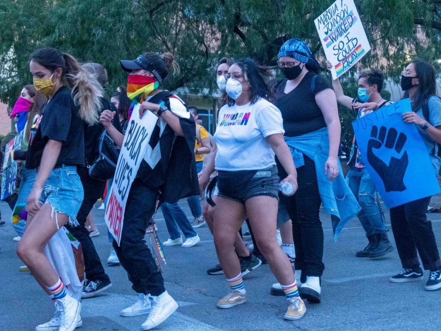 Protesters join in a group line dance during Queer Solidarity  March  in Downtown El Paso June 13, 2020.