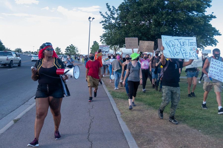 Organizer+Lisa+Laslor++leads+protesters++in+march+on+outskirts+of+Veterans+Park+along+Rushing+Road+during+Juneteenth+Rally+Saturday+June+19%2C+2020.