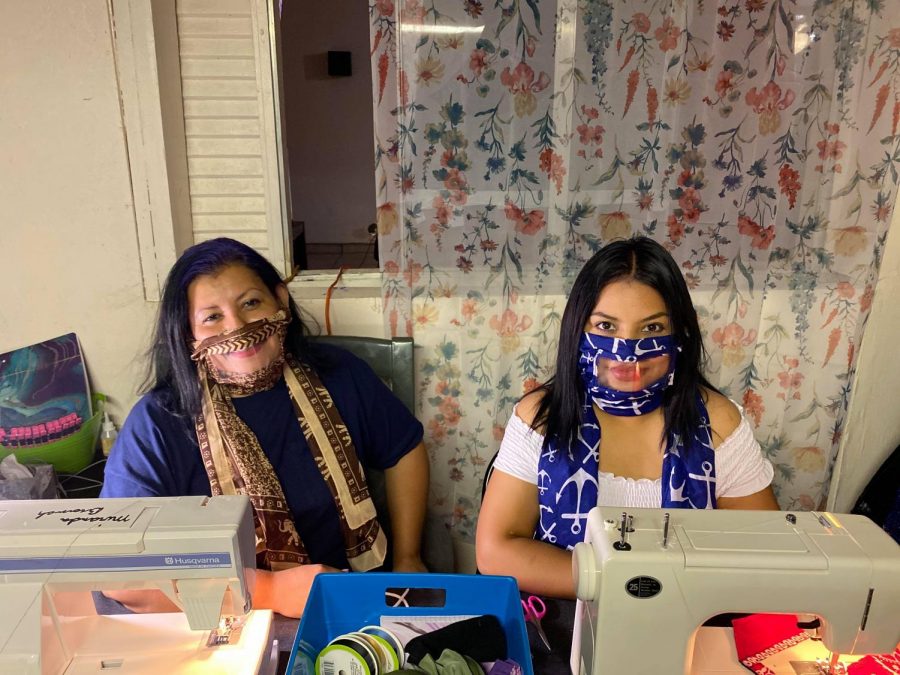 Las Cruces, New Mexico residents Karla Martinez and daughter  Lesley Campa  sit behind their home work area to produce masks for the hearing impaired June 3.