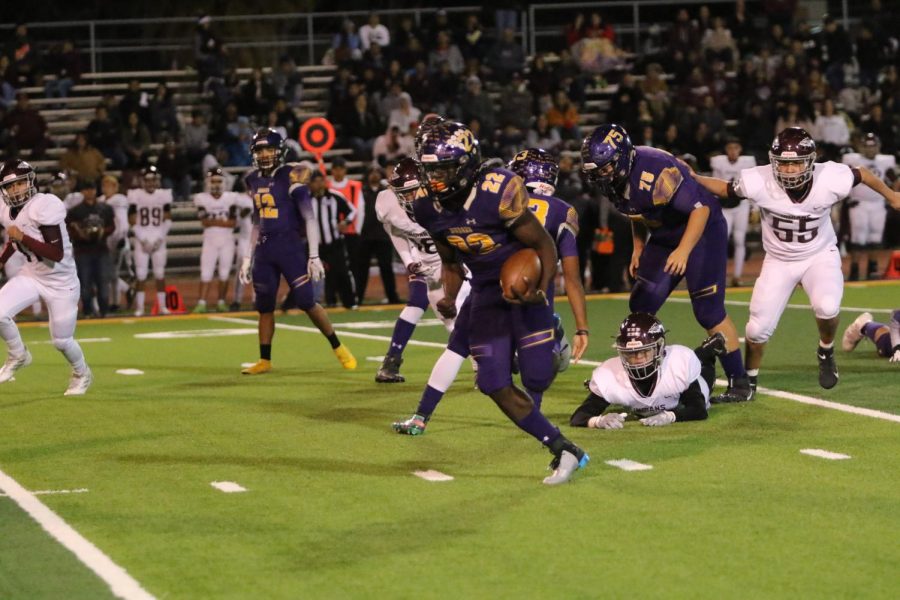 Burges High School running back Tavorus Jones bursts through the line of scrimmage in playoff game versus Ysleta High School Nov. 15, 2019.