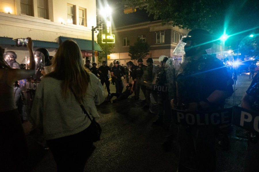 El Paso police drag a protester behind their line as tensions flare as police try to move crowd back 10 feet June 2.