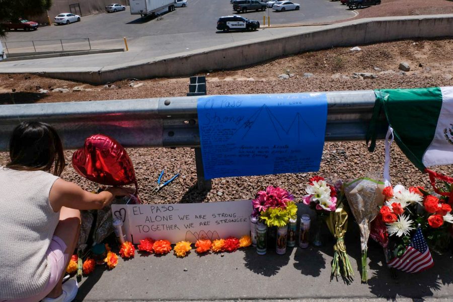 A woman pays her respects to the victims of Aug. 3, 2019 mass shooting at Cielo Vista Walmart.