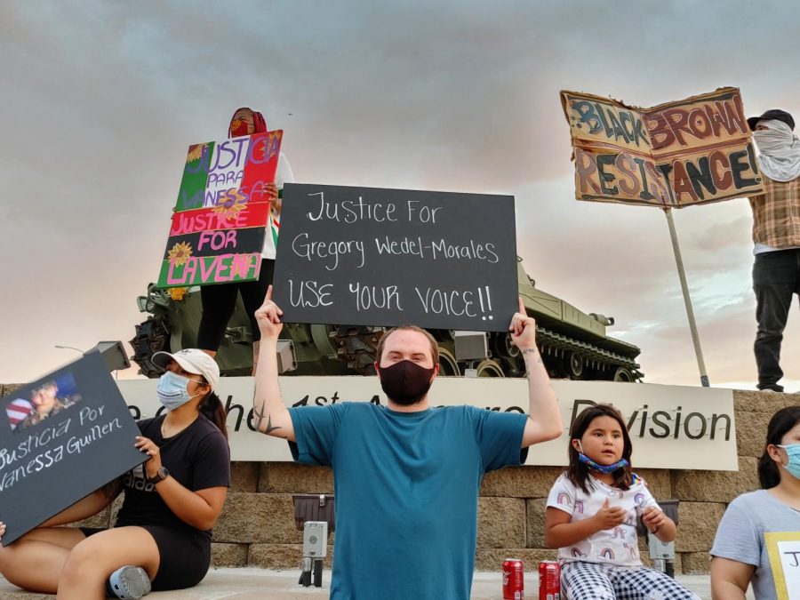 Protesters hold up signs outside of Fort Bliss to demand justice for missing Fort Hood soldier Vanessa Guillen July 4, 2020.
