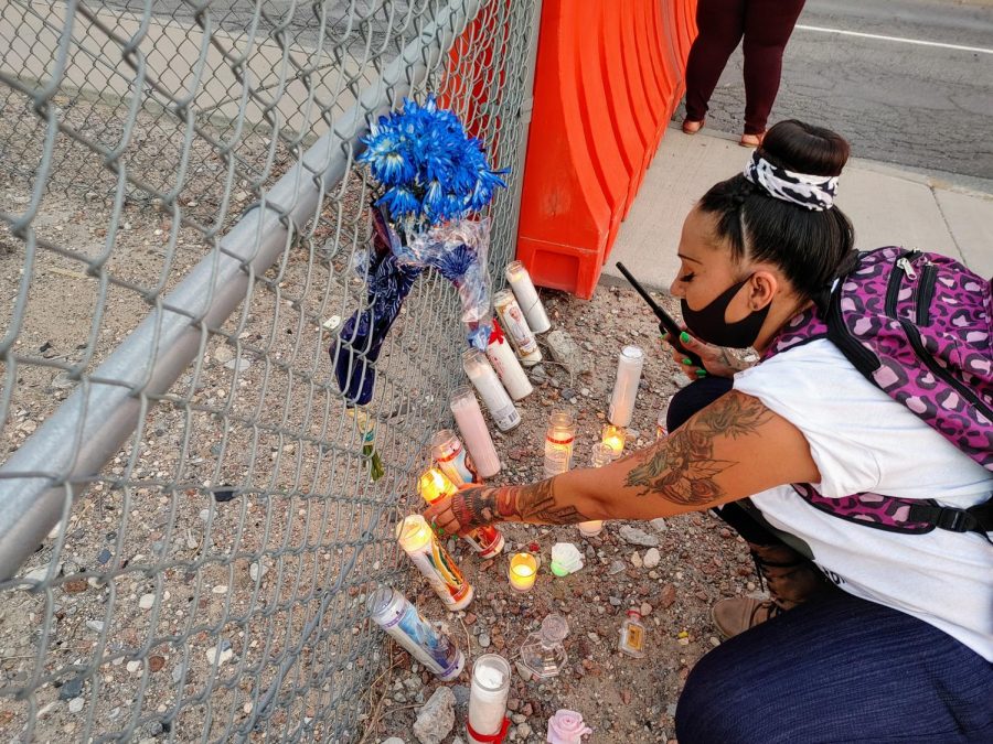 Monica Brown lights candles for Vanessa Guillen on the Fort Bliss fence during a protest for justice July 4, 2020.