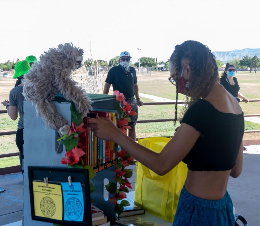 UTEP+senior+Kierra+Lopez-Robinson+sets+up+her+mobile+library+for+her+program+she+calls++Readvolution+during+a+Juneteenth+event+in+Northeast+El+Paso+June+19%2C+2020