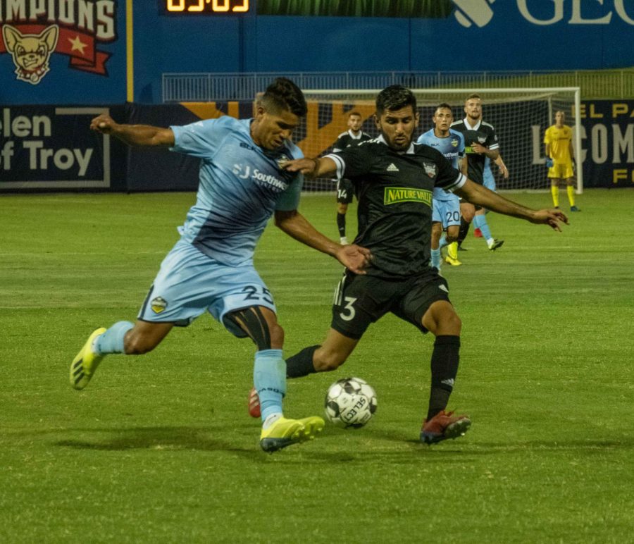 Locomotive defender Bryam Rebellion fights off Toro defender during opening season 1-0 victory Saturday, July 11, 2020.