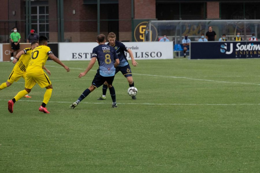 Locomotive midfielders Nick Ross and Richie Ryan  try to zero in on ball versus New mexico July 15, 2020.
