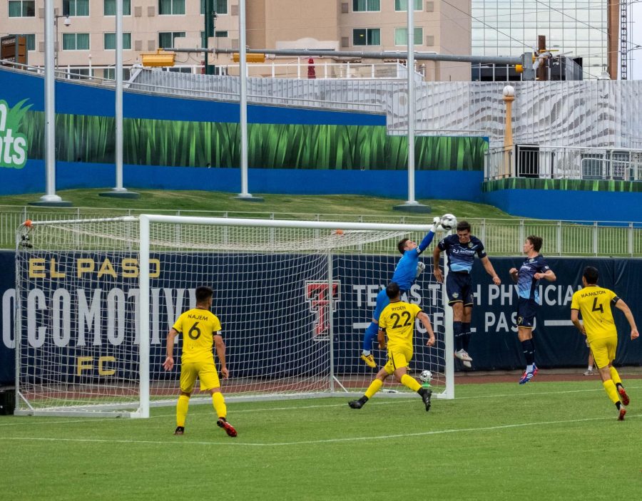 New Mexico goalkeeper  fights to keep header from reaching his goal by forward Omar Salagado July 15, 2020.