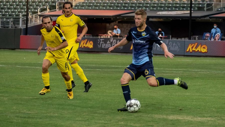 Locomotive midfielder Richie Ryan prepares to pass downfield versus New Mexico July 15, 2020.