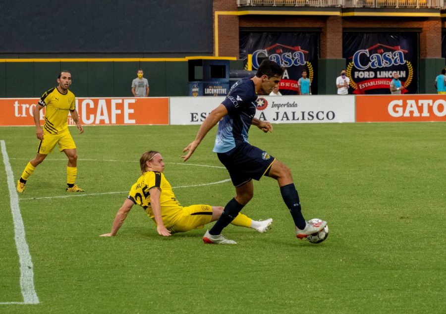 Locomotive forward Omar Salgado trips up opposing New Mexico player with his footwork versus the United July 15, 2020.