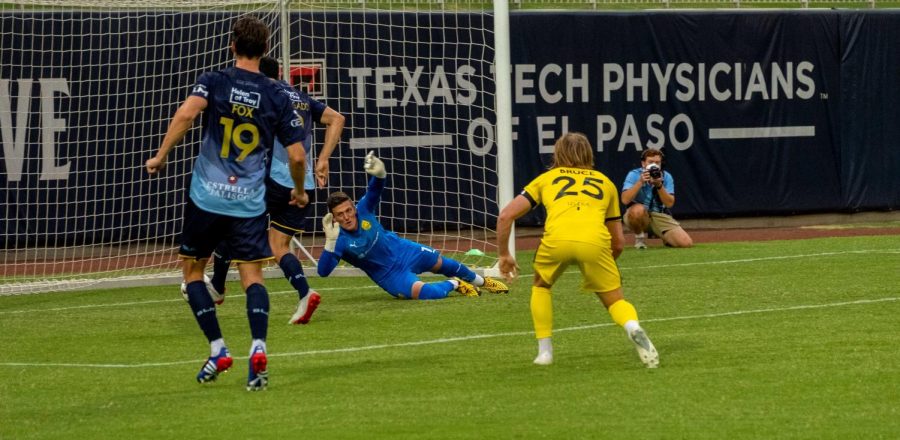 Locomotive forward Omar Salgado tips ball past a diving United goalkeeper for the  first El Paso score versus New Mexico july 15, 2020.
