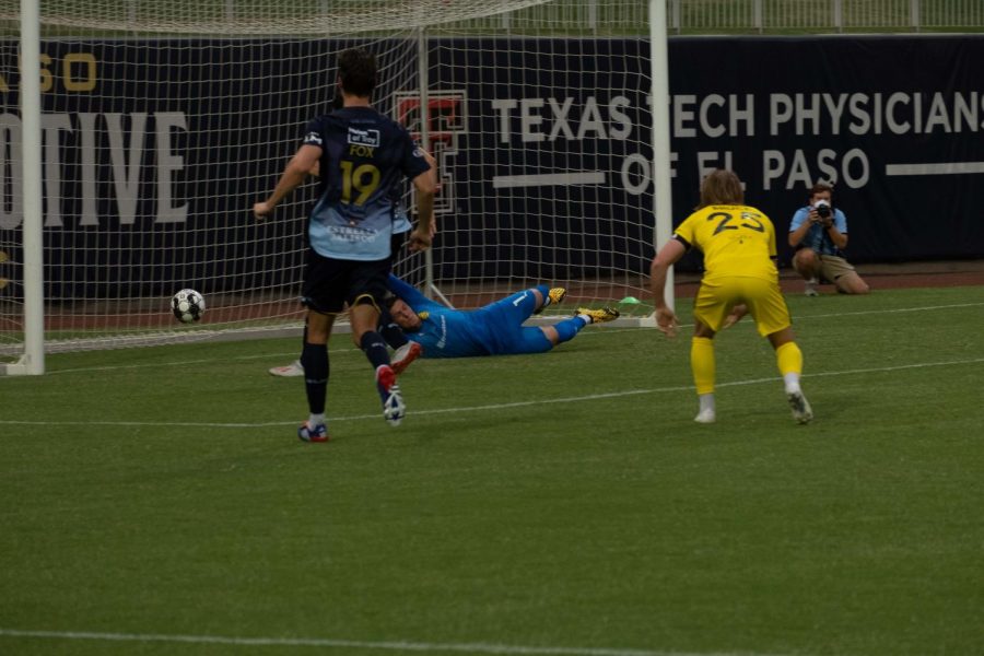 Locomotive forward Omar Salgado tips ball past a diving United goalkeeper for the  first El Paso score versus New Mexico july 15, 2020.