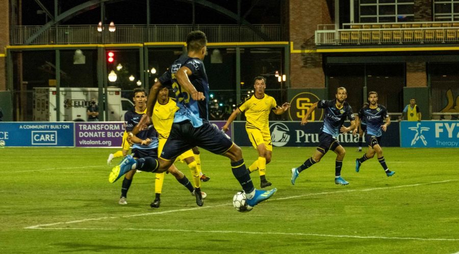 Locomotive defender Bryam Rebellon takes to air to set a pass to teammate verus New Mexico July 15, 2020.