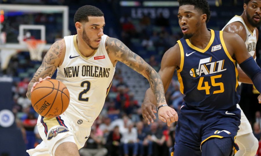 Oct 11, 2019; New Orleans, LA, USA; New Orleans Pelicans guard Lonzo Ball (2) drives against Utah Jazz guard Donovan Mitchell (45) in the first quarter at the Smoothie King Center. Mandatory Credit: Chuck Cook-USA TODAY Sports