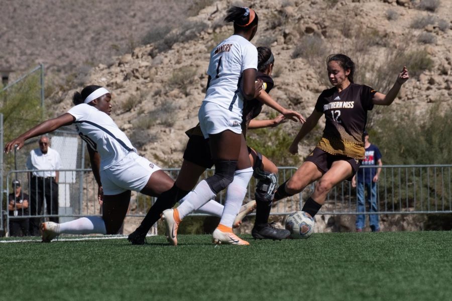 UTEP Junior forward Jo Jo Ngongo takes a hard slide to strip ball from Southern Miss Oct. 20, 2019.