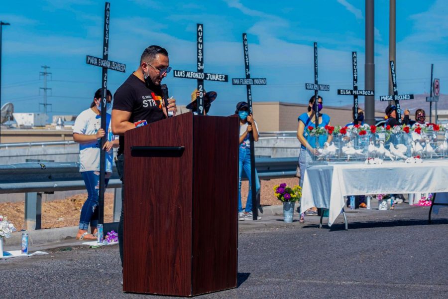 The names of the 23 victims of the Cielo Vista  Walmart shooting are read as crosses bearing their names are in background Aug. 03, 2020.