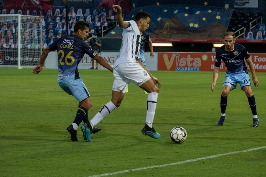 Locomotive forward Jose Aaron Gomez and midfielder Nick Ross pressure Colorado forward Saturday Aug. 8, 2020.