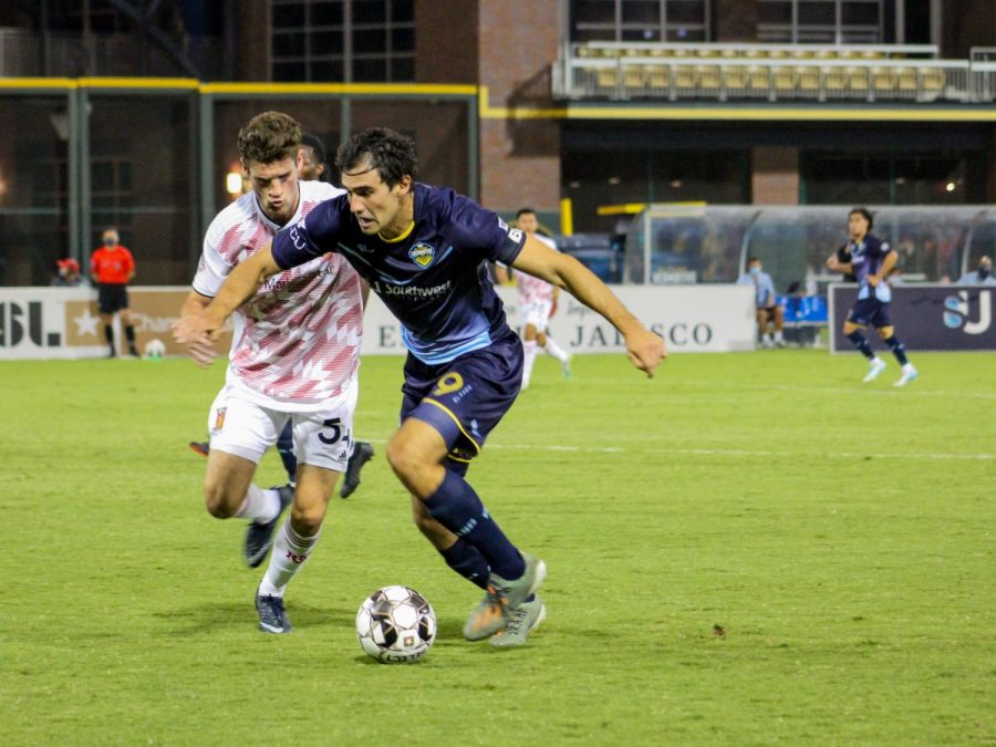 El Paso Locomotive Forward Omar Salgado runs against a member of Real Monarchs at Southwest University Park, Saturday, Sept. 19.