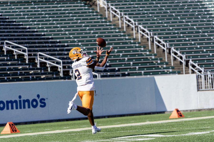 UTEP senior wide receiver Justin Garret reels in a pass in pregame warmups versus Charlotte Oct 24.