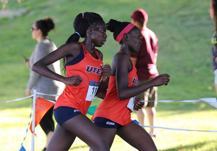 UTEP senior Caroline Chepkosegei  runs alongside former teammate Linda Cheruiyot at Lori Fitzgerald Classic at Chamizal Park in El Paso Sept. 13, 2019. 