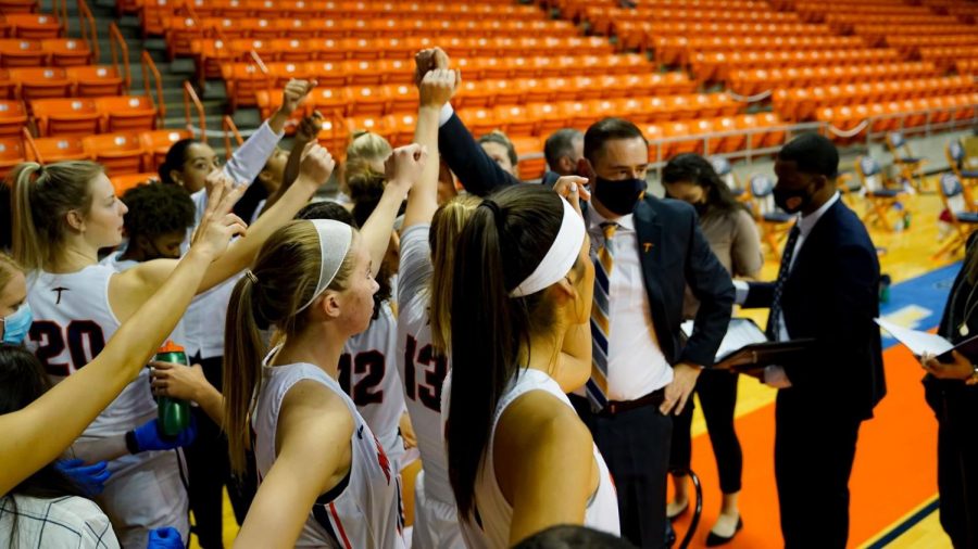 UTEP coach Kevin Baker motivates the womens basketball team as they take the court against New Mexico State Nov. 25.