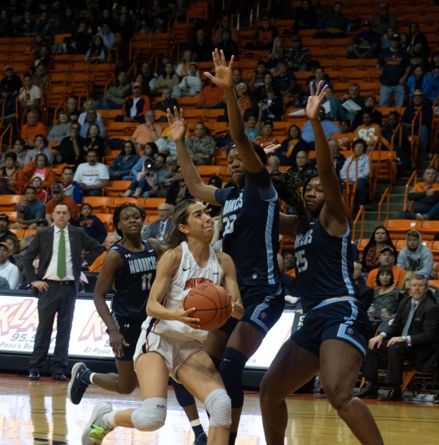 UTEP point guard Katia Gallegos drives to the basket drawing two Monarch players to defend her versus Old Dominion Feb 8, 2020.