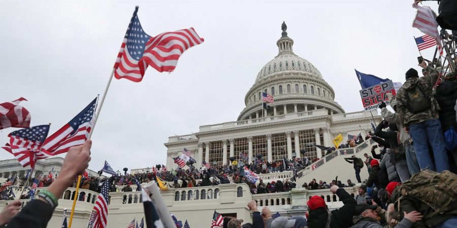 A mob of supporters of President Donald Trump storm the U.S. Capitol on Jan. 6.