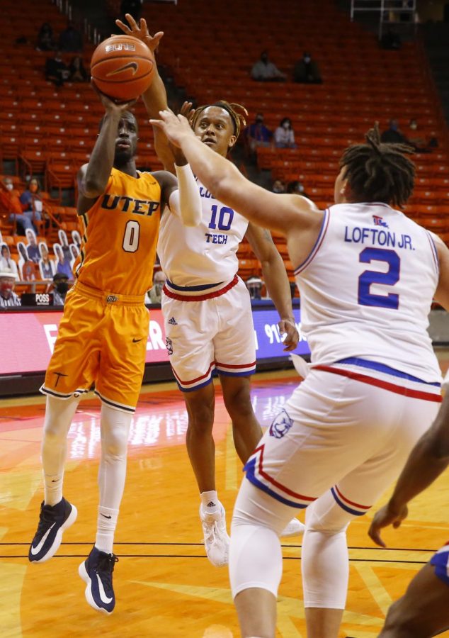 UTEP junior guard Souley Boum drives to the basket between two Bulldog defenders, versus Louisiana tech Jan. 23.